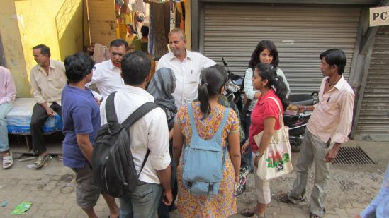 Left: Students interacting with contractor Chand Bhai in Shivaji Nagar, Deonar. Right: Detail of one of the students’ panel features the contractor.