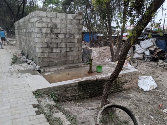 Hand pumps installed in the settlement.