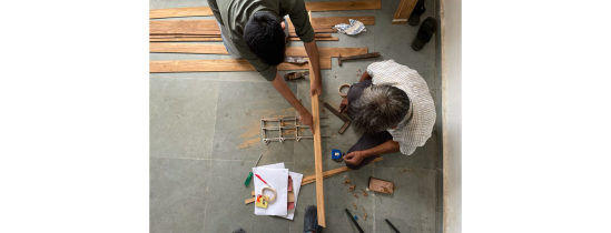 Cutting and contemplating at the Urbz office. 