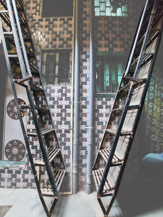 Facing staircases that lead to different houses on the upper storey