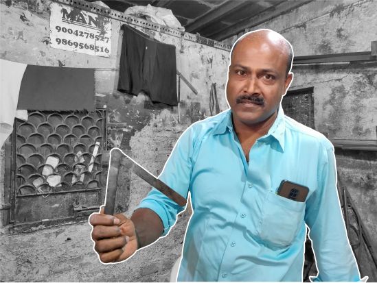 Mani Bhai showcasing the tool (kath-kuna) to calculate the slope of the staircase.