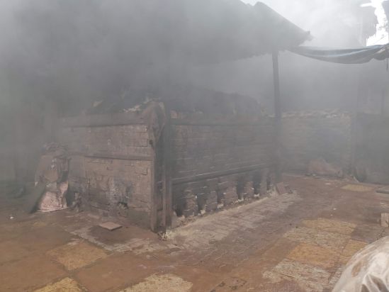  The pots, stacked up in the kiln, getting fired.