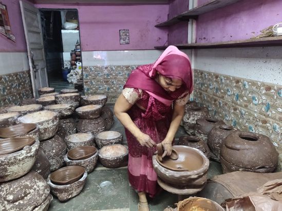 The pots are initially shaped on the wheel and subsequently refined in the moulds and left to dry.