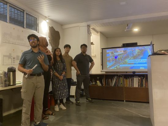 (NYUAD students presenting project briefs at the Homegrown street exhibition)