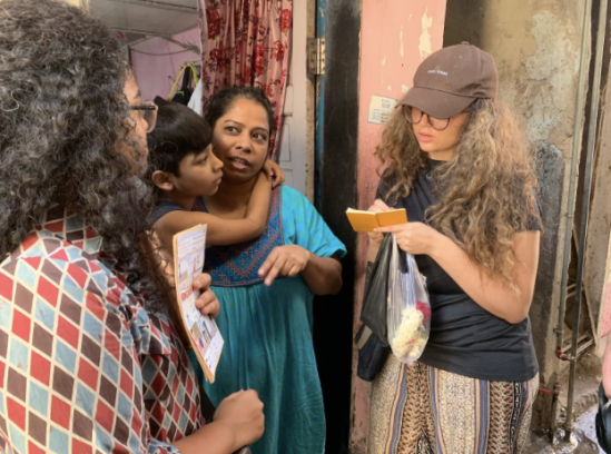  locals in the neighbourhood being interviewed by students