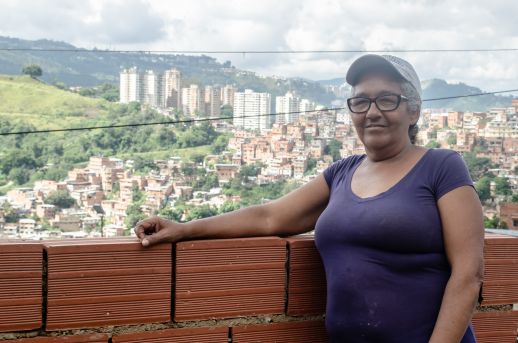 Yolanda Vegas stands in the third floor in process of her neighbors home, overseeing Petare, the place she has called home for the last 50 years. Photograph by Stephanie Marcelot