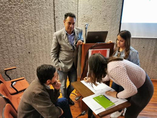 Attendees in an open discussion on the evaluation of the effectiveness of community projects.