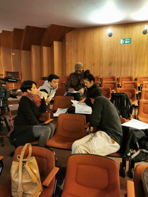 Attendees in an open discussion on the evaluation of the effectiveness of community projects.
