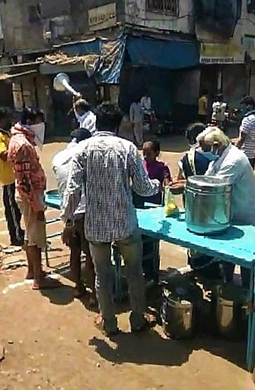 Distribution of packed meals by residents