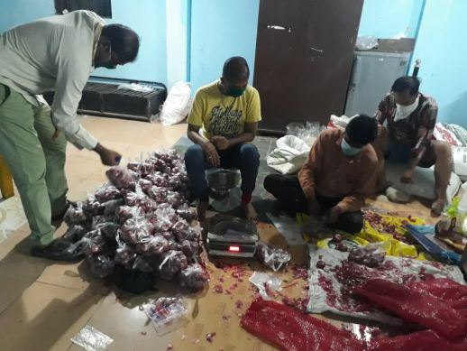 Packing of rations by local residents and NGO's