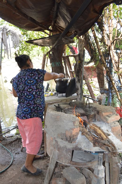  Lucina, Tobias’s mom cooking on her stove.