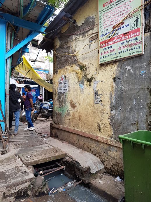 Clogged open drains can be found in the vicinity of the toilet block and make playing in the neighborhood hazardous for the children