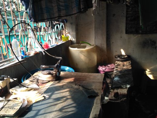 Ironing table next to washing area