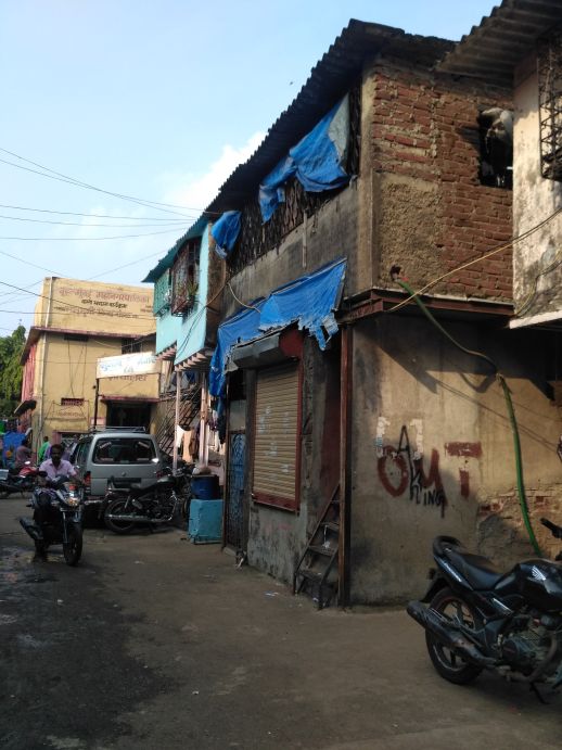 Public toilet on the left of the too - house