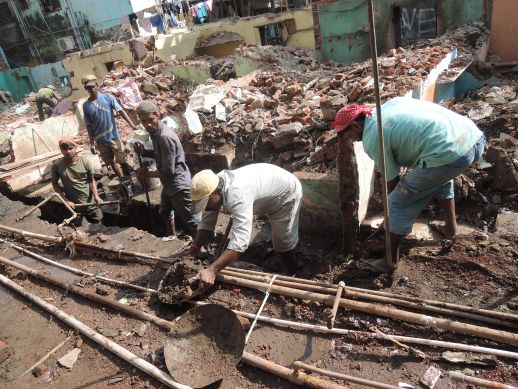 Men at work at Jairam Seth Chawl in Dharavi Koliwada