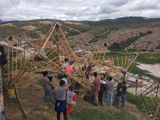 Modules of the structure are carried to the site