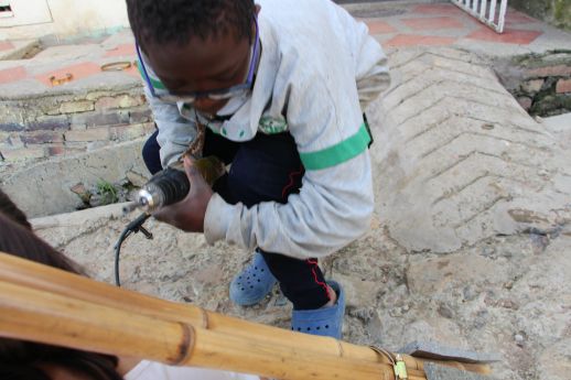 Kids participate in the assembly of the structure