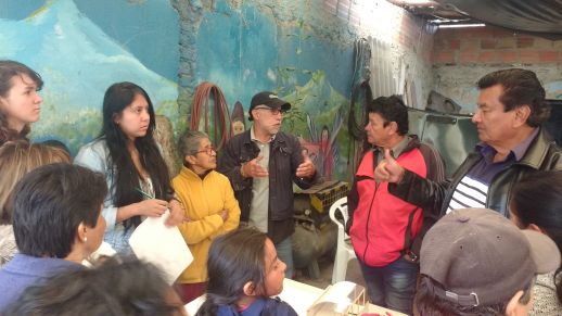 urbz Team discussing the programs in the Community Center with the residents