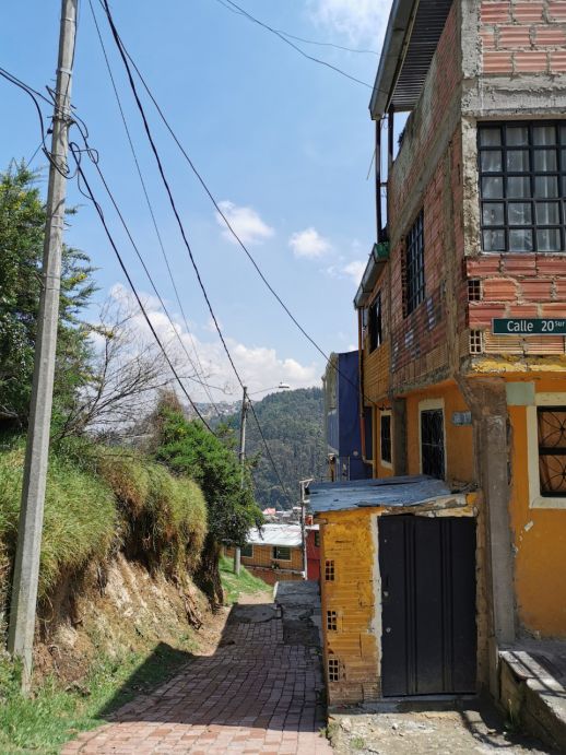 Incremental construction of a home with hollow clay bricks.