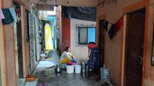 Women sharing communal taps.