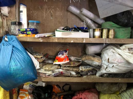 Storage of materials and equipment in the corner of the workshop.
