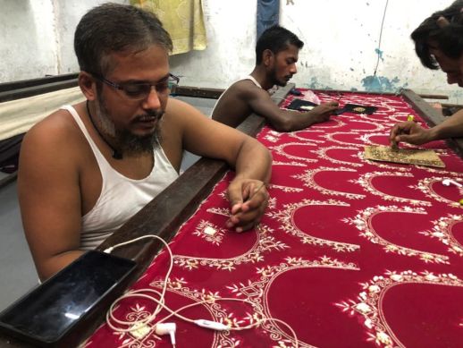 Applying the finishing touches to the designs.