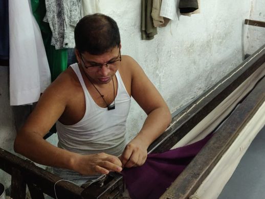 Fixing the cloth to the wooden frame